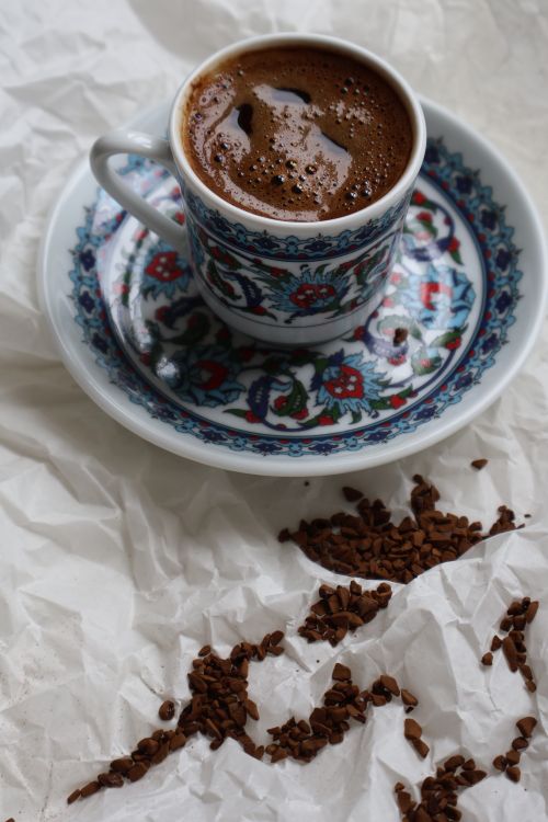 Free Elegant cup of Turkish coffee with intricate floral design, offering a rich cultural experience. Stock Photo
