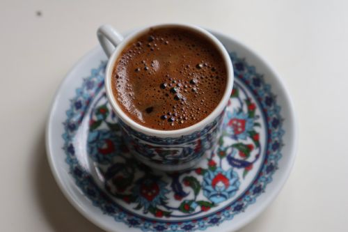 Free A close-up of Turkish coffee with foam in a decorated cup and saucer. Stock Photo