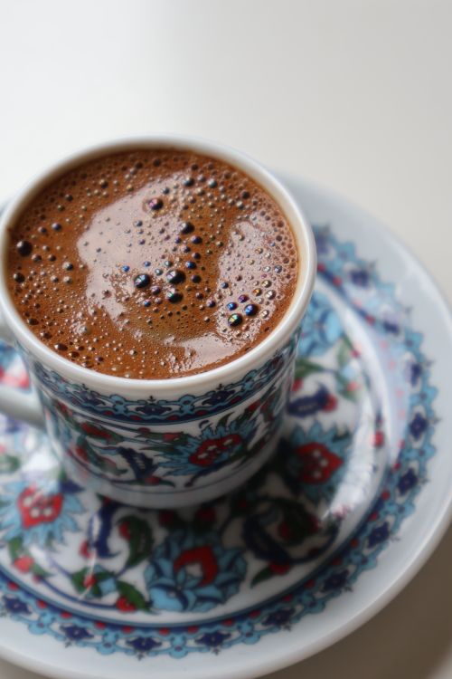 Free Close-up of Turkish coffee in an intricately designed cup on a saucer. Stock Photo