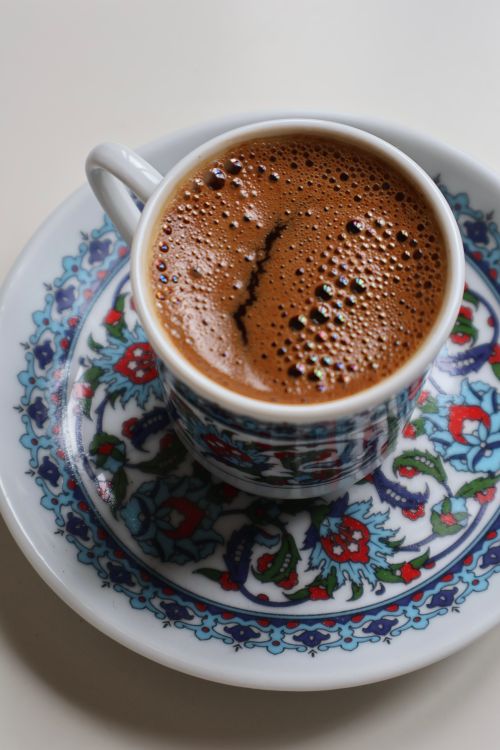 Free Close-up of hot Turkish coffee in ornate cup, rich aroma and bold flavor captured. Stock Photo