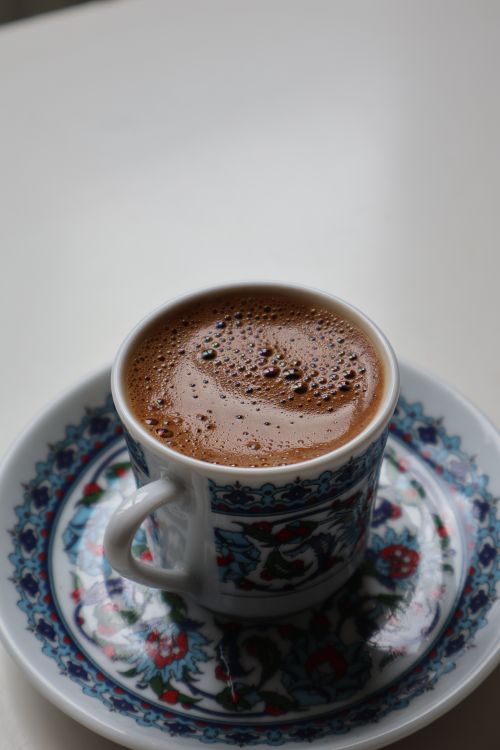 Free Traditional Turkish coffee served in a decorative cup and saucer with intricate designs. Stock Photo