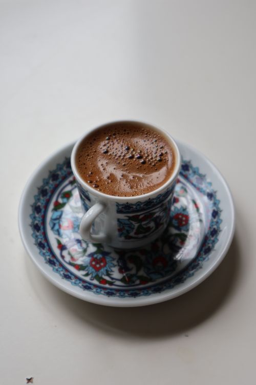 Free Close-up of Turkish coffee served in a traditional floral patterned cup and saucer. Stock Photo