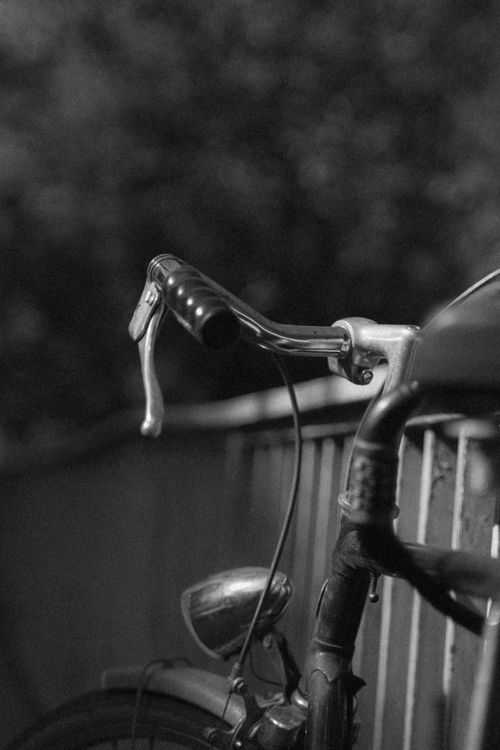 Free Artistic black and white photo of a vintage bicycle handlebar in Graz, Austria. Stock Photo