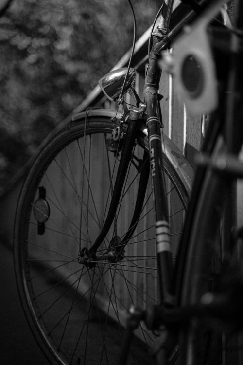 Free Artistic black and white photo of a vintage bicycle on a bridge in Graz, Austria. Stock Photo