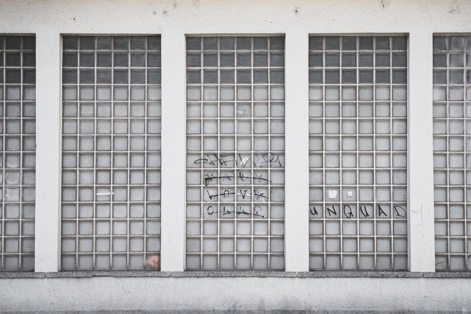 Glass block wall with subtle graffiti providing a modern urban feel in Graz, Austria. Glass block wall with subtle graffiti providing a modern urban feel in Graz, Austria.