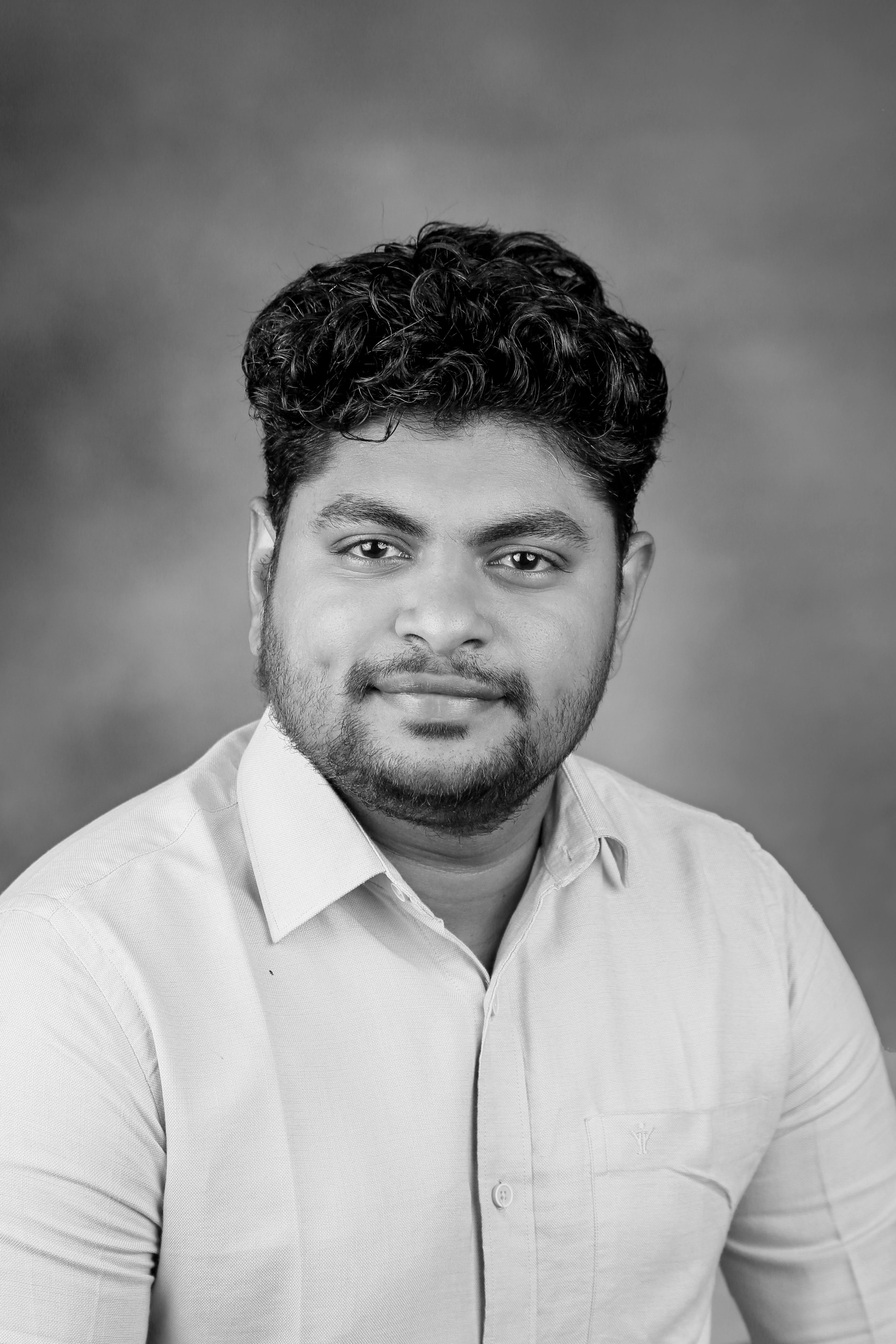 Black and white portrait of a male adult in formal attire, ideal for business use.