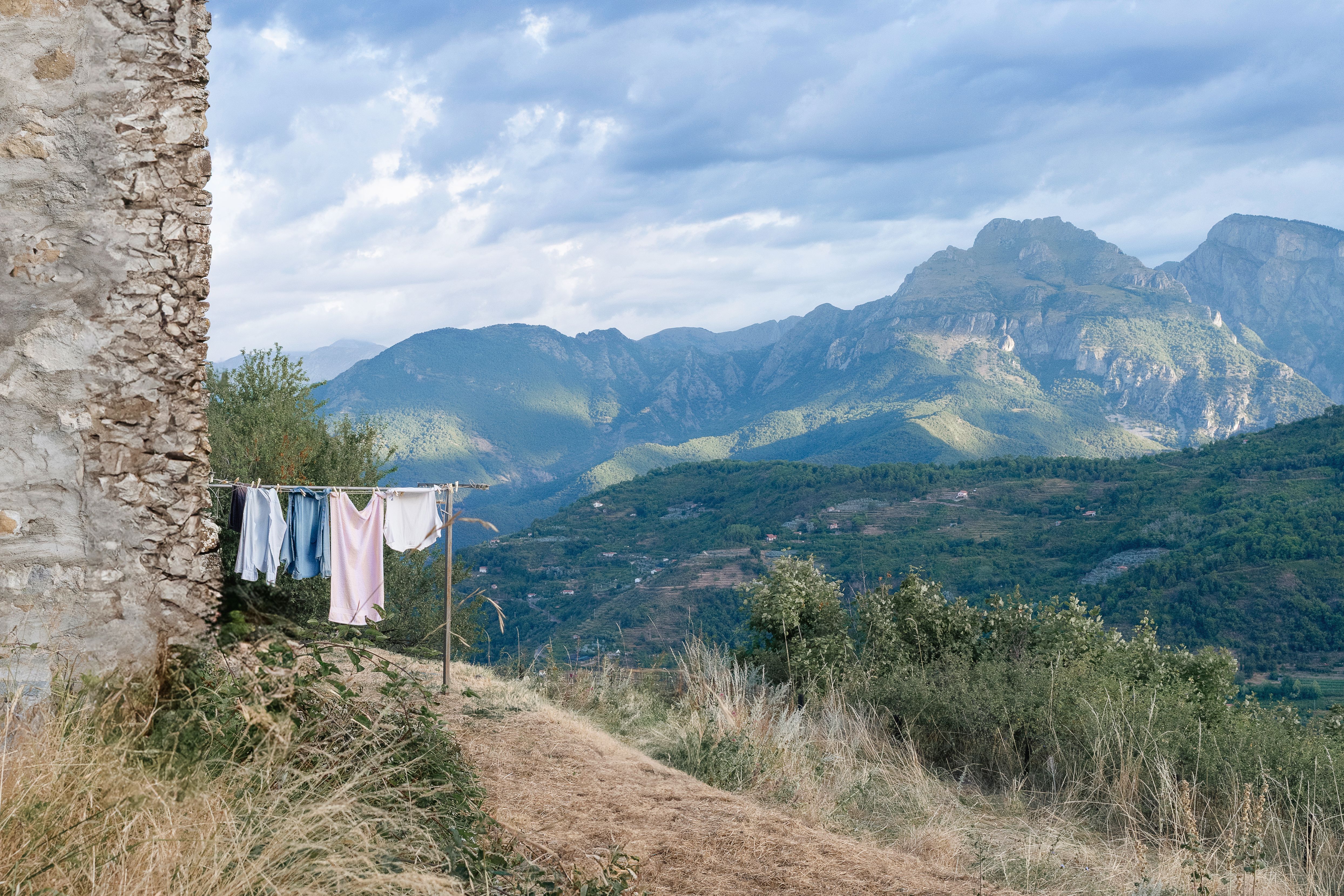 Idyllic mountain landscape with rustic charm and clothes drying on a line.
