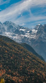 Breathtaking landscape of Jade Dragon Snow Mountain against a clear sky in Lijiang, China.