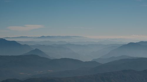Free A breathtaking view of mountain layers under a clear blue sky in Lijiang, China. Stock Photo