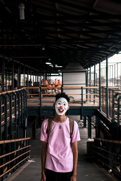 Free Person Wearing Pink Shirt and Face Mask Stock Photo