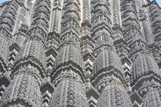 Close-up view of intricate stone carvings on a historical architectural facade.