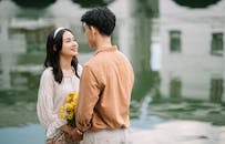 Young Couple Sharing a Tender Moment by the Water