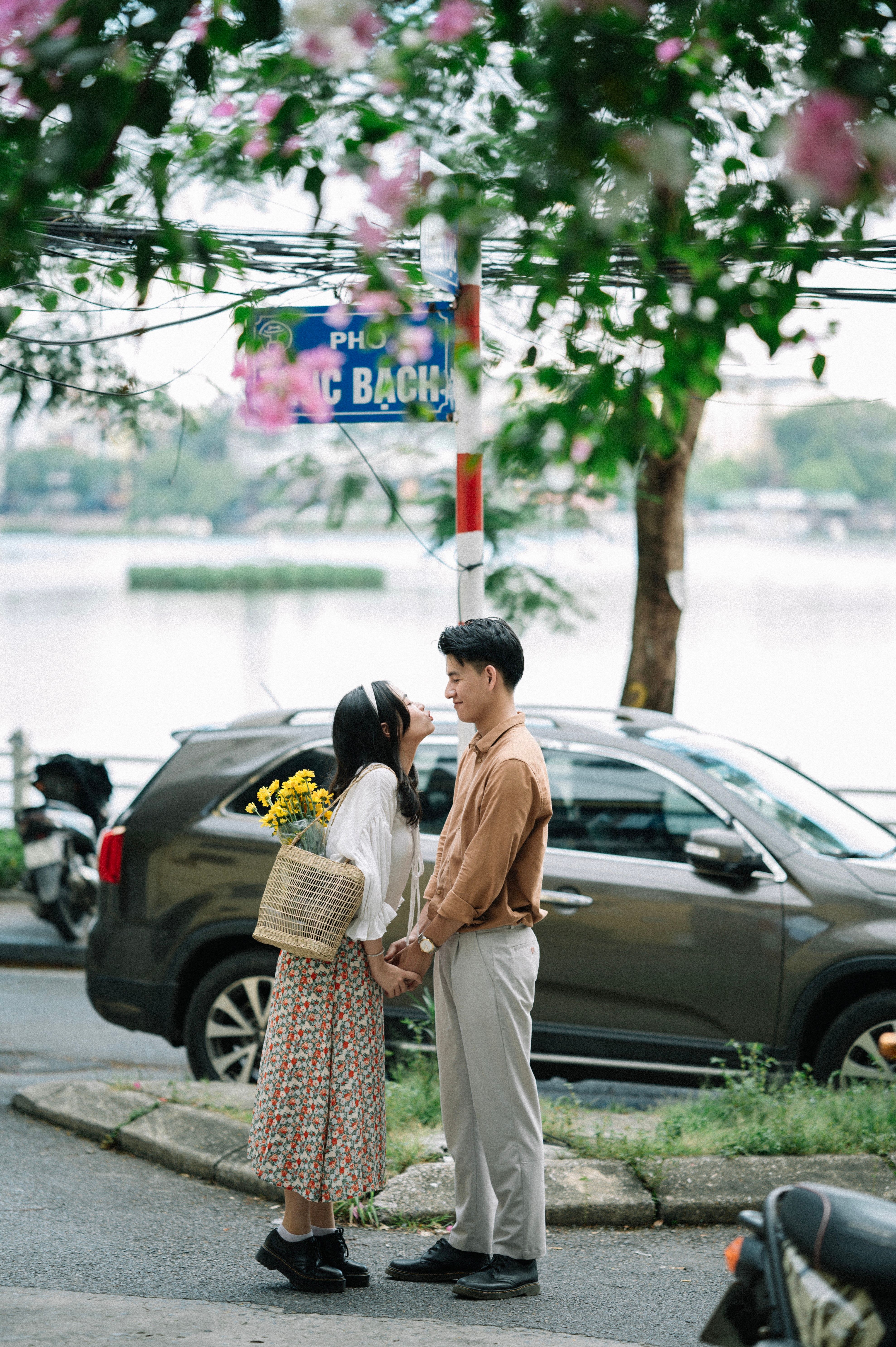 Romantic Couple Holding Hands Outdoors · Free Stock Photo