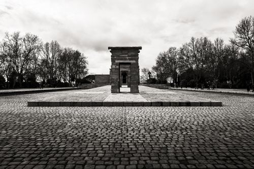 Free Black and white image of the Temple of Debod in Madrid, Spain, with a dramatic sky. Stock Photo