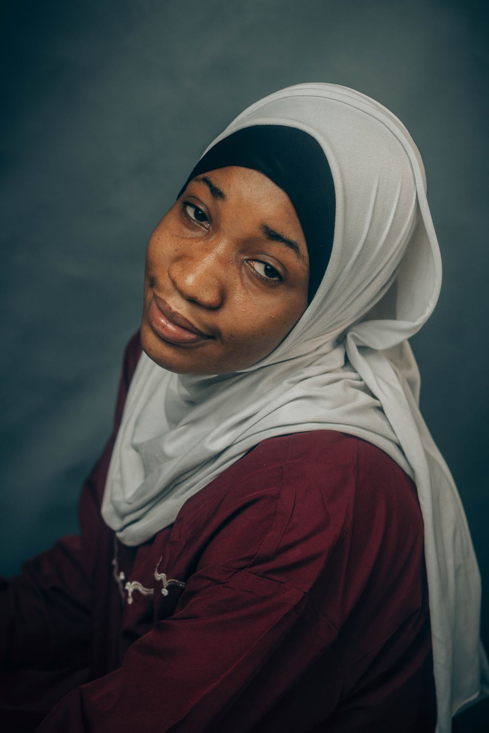 Portrait of a Woman in Hijab with a Warm Smile · Free Stock Photo