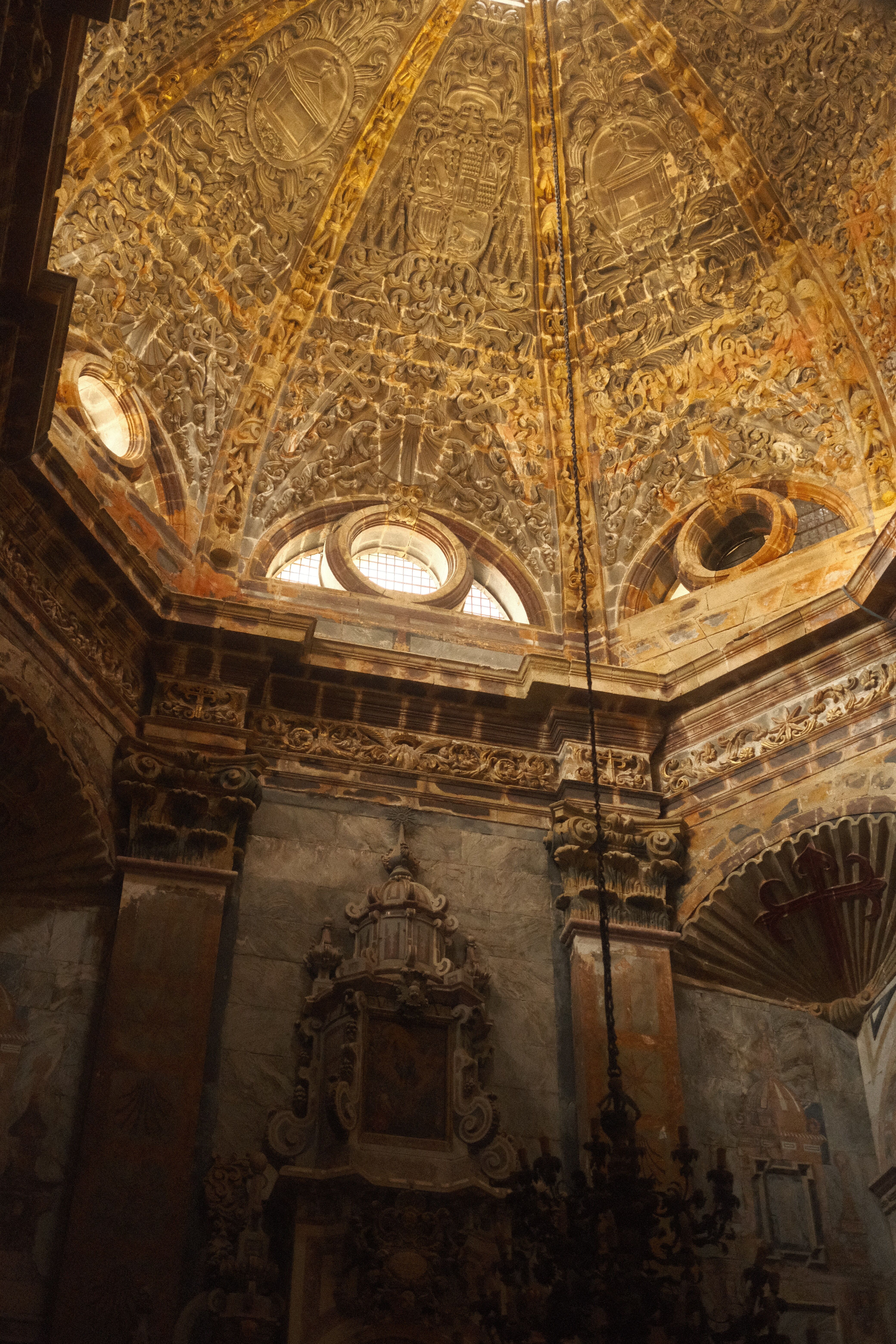 Explore the ornate ceiling of the Santiago de Compostela Cathedral in Spain, showcasing historic architecture.