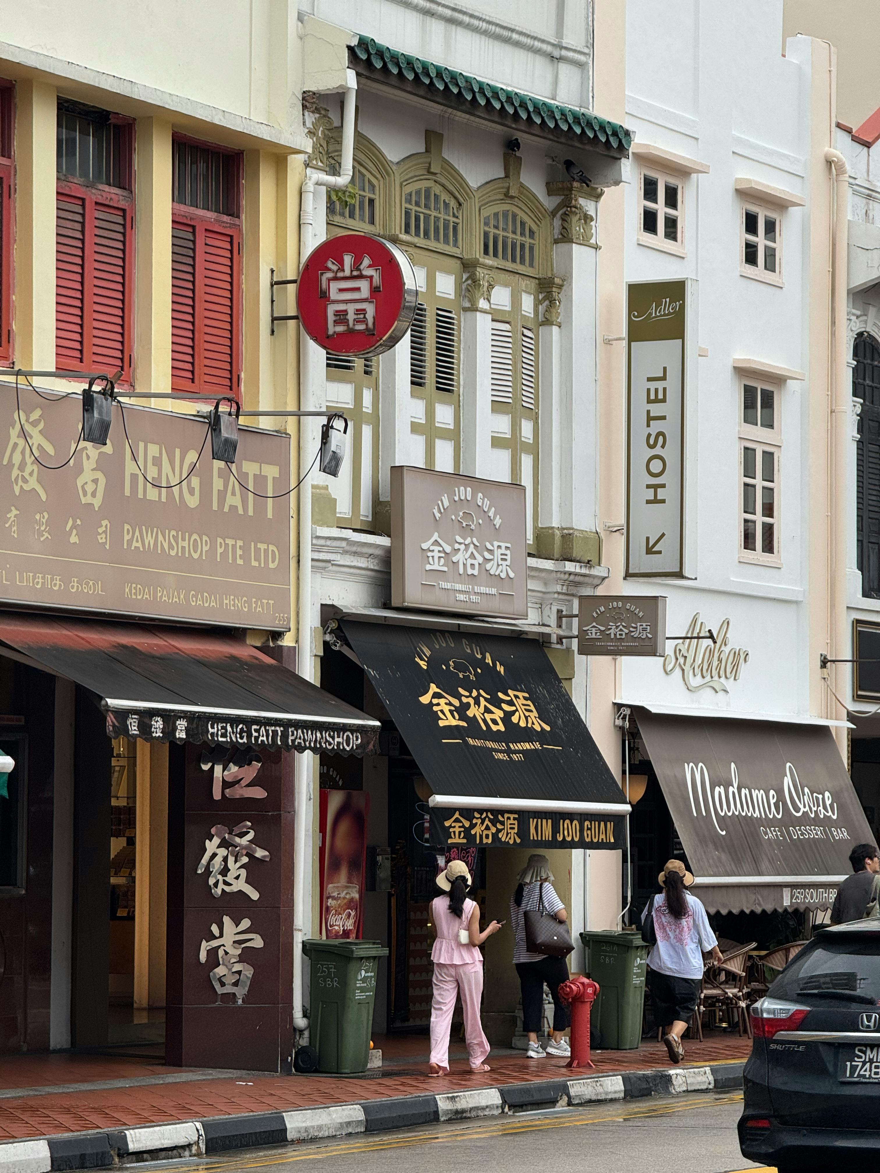 Vibrant shophouses line a street in Singapore
