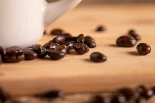 Black Coffee Beans on Brown Wooden Table