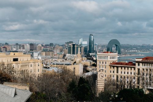 Free Overcast cityscape of Baku, Azerbaijan with iconic architecture and urban skyline. Stock Photo