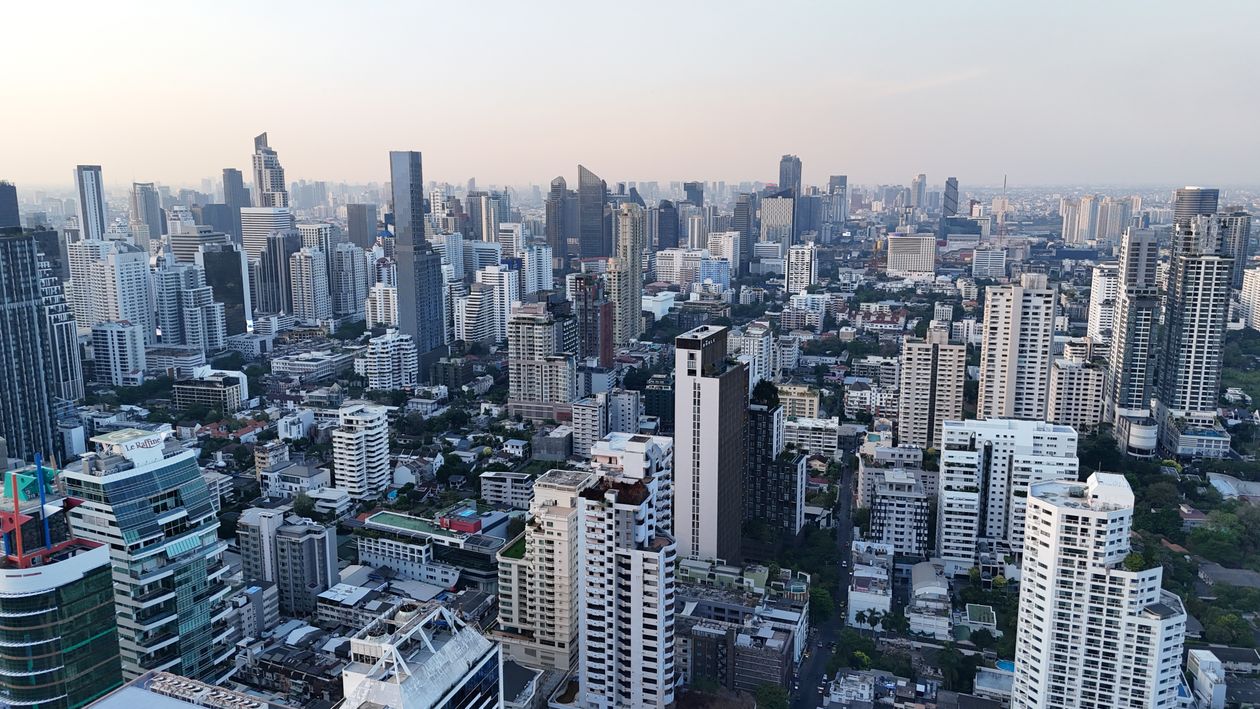 Bangkok city skyline at dusk with illuminated skyscrapers