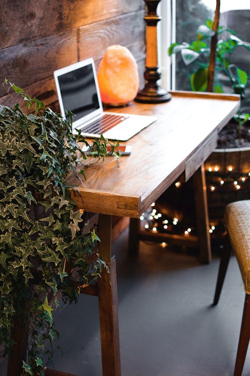 Free Himalayan Salt Lamp Near Laptop On Wooden Table Stock Photo