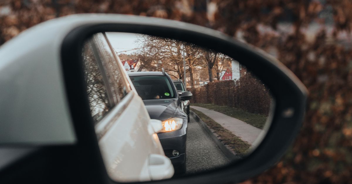 Car Without Light Reflection Car Mirror Reflection in Urban Setting · Free Stock Photo