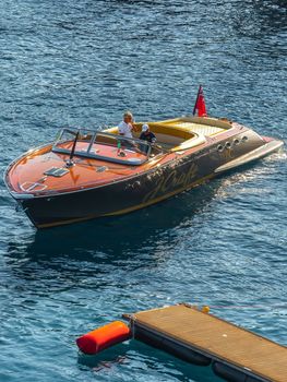 Elegant speedboat cruising in the pristine blue waters of Göcek, Muğla, Turkey on a sunny day. — photo by Ramazan Toygun