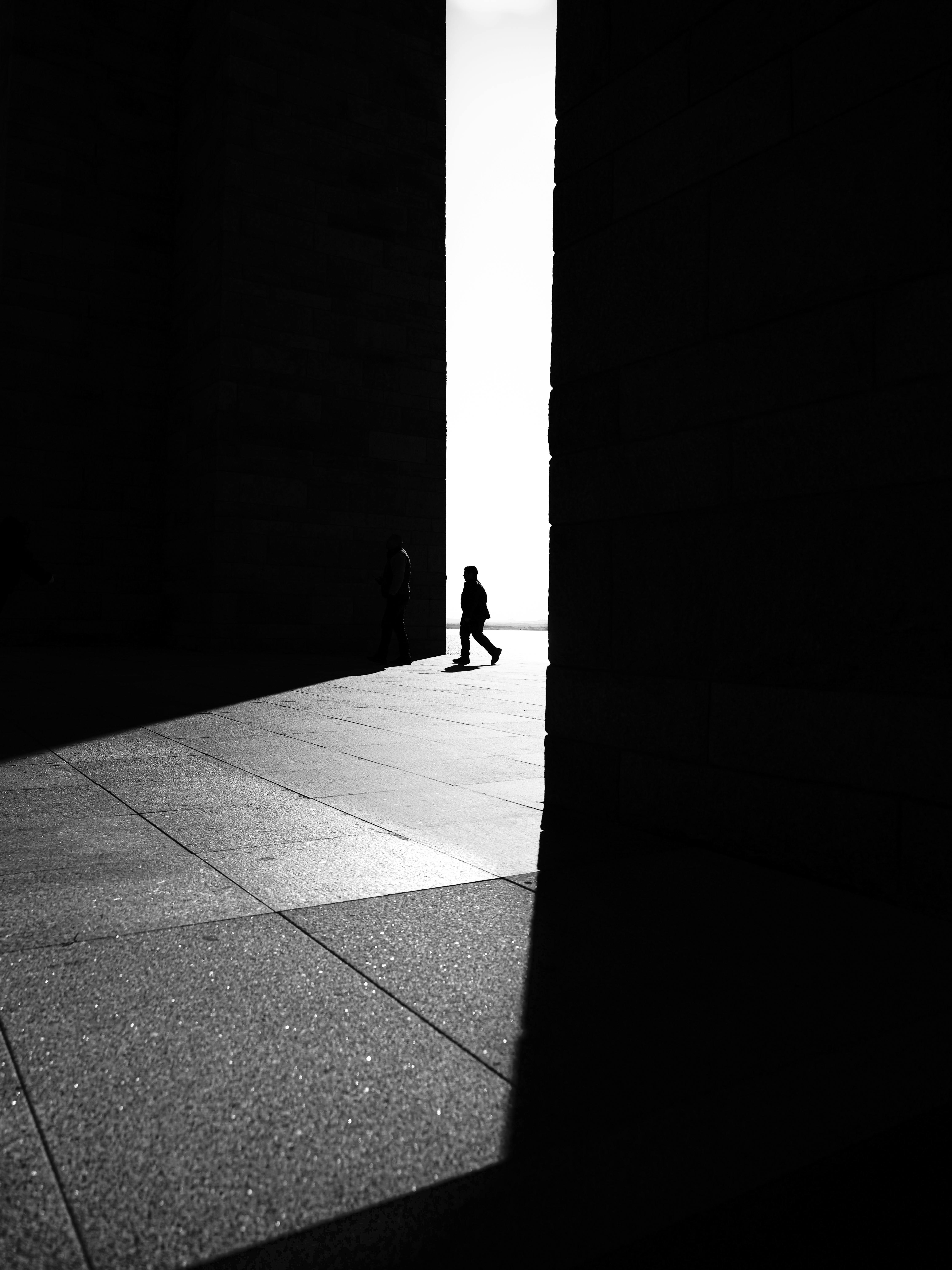 Free Black and white silhouette of people at Çanakkale monument reflecting dramatic light and shadows. Stock Photo