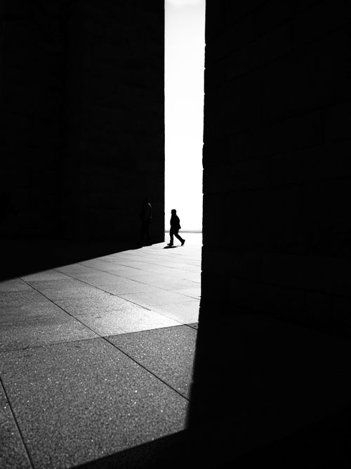 Free Black and white silhouette of people at Çanakkale monument reflecting dramatic light and shadows. Stock Photo
