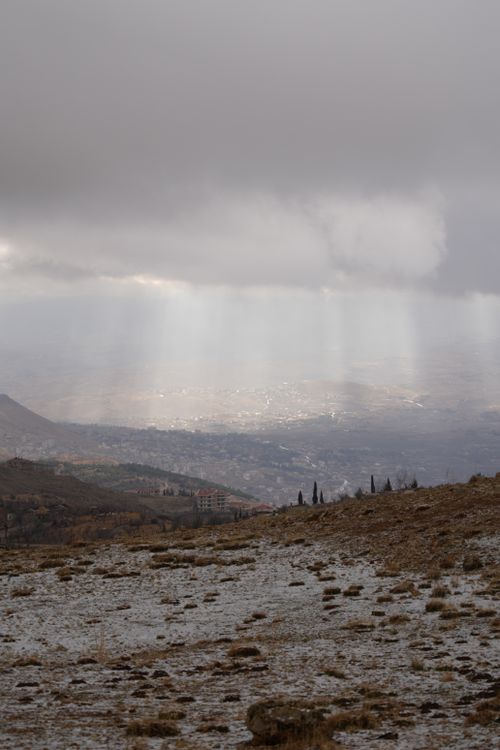 Free Stunning view of dramatic clouds casting light over the city landscape of Damascus, Syria. Stock Photo