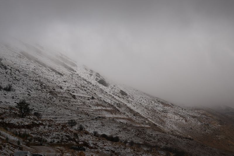 Mist-covered snowy mountain slope — photo by Baraa Obied on Pexels