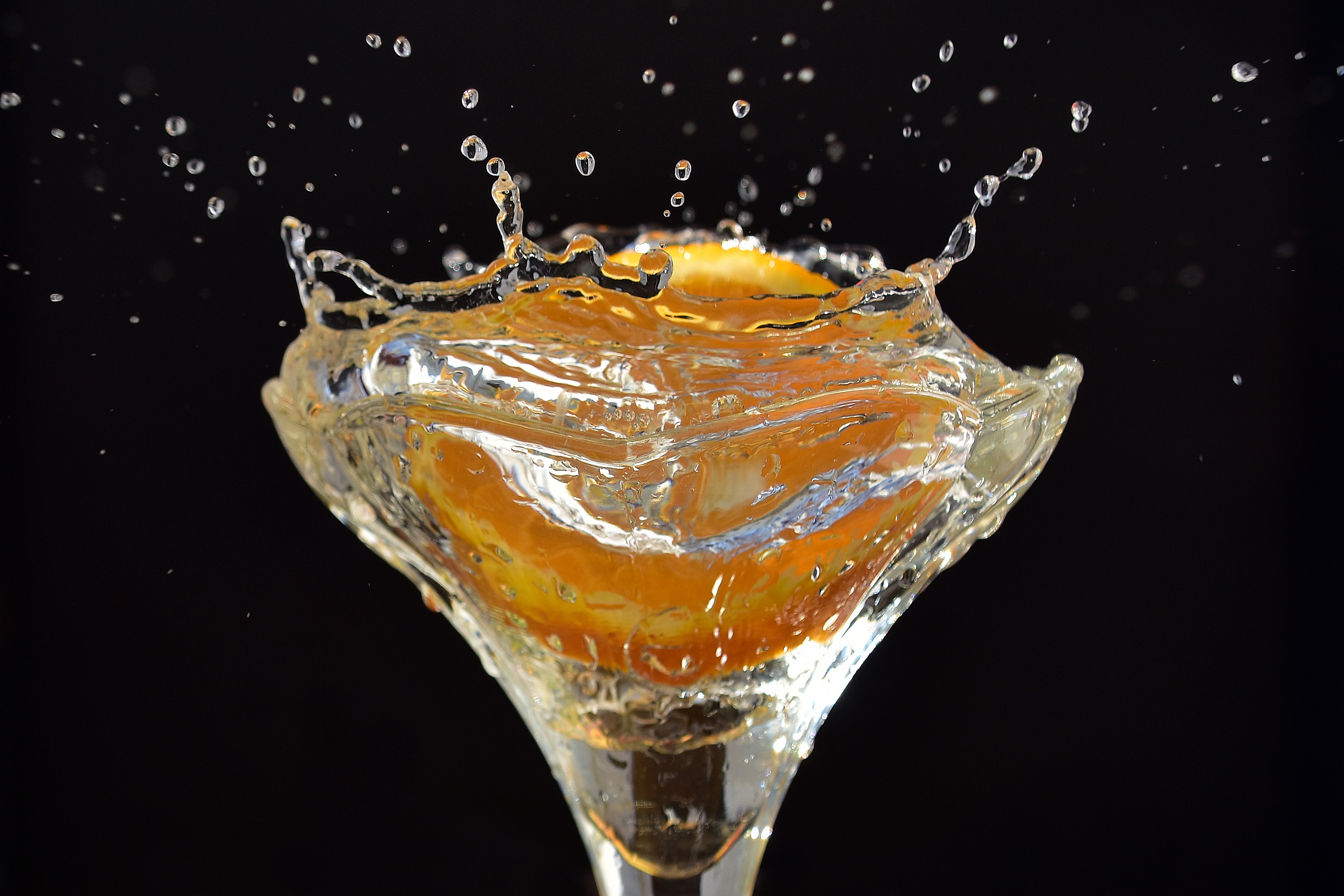 Bartender preparing a cocktail with Triple Sec and fresh citrus