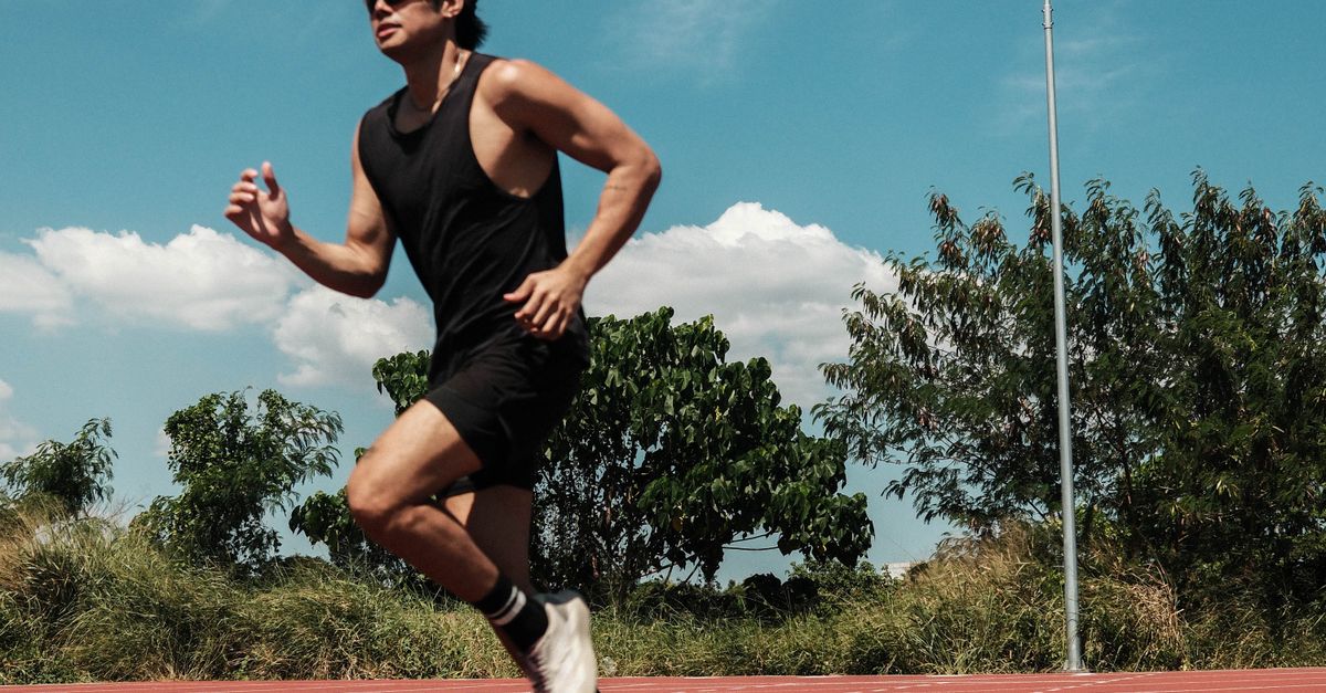 Pinoy Jogging Filipino Athlete Running on Track in Taytay · Free Stock Photo