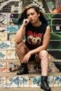 Edgy Woman in Punk Fashion on Graffiti Stairs