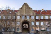Explore the classic red brick and symmetrical design of Danish architecture in Copenhagen.