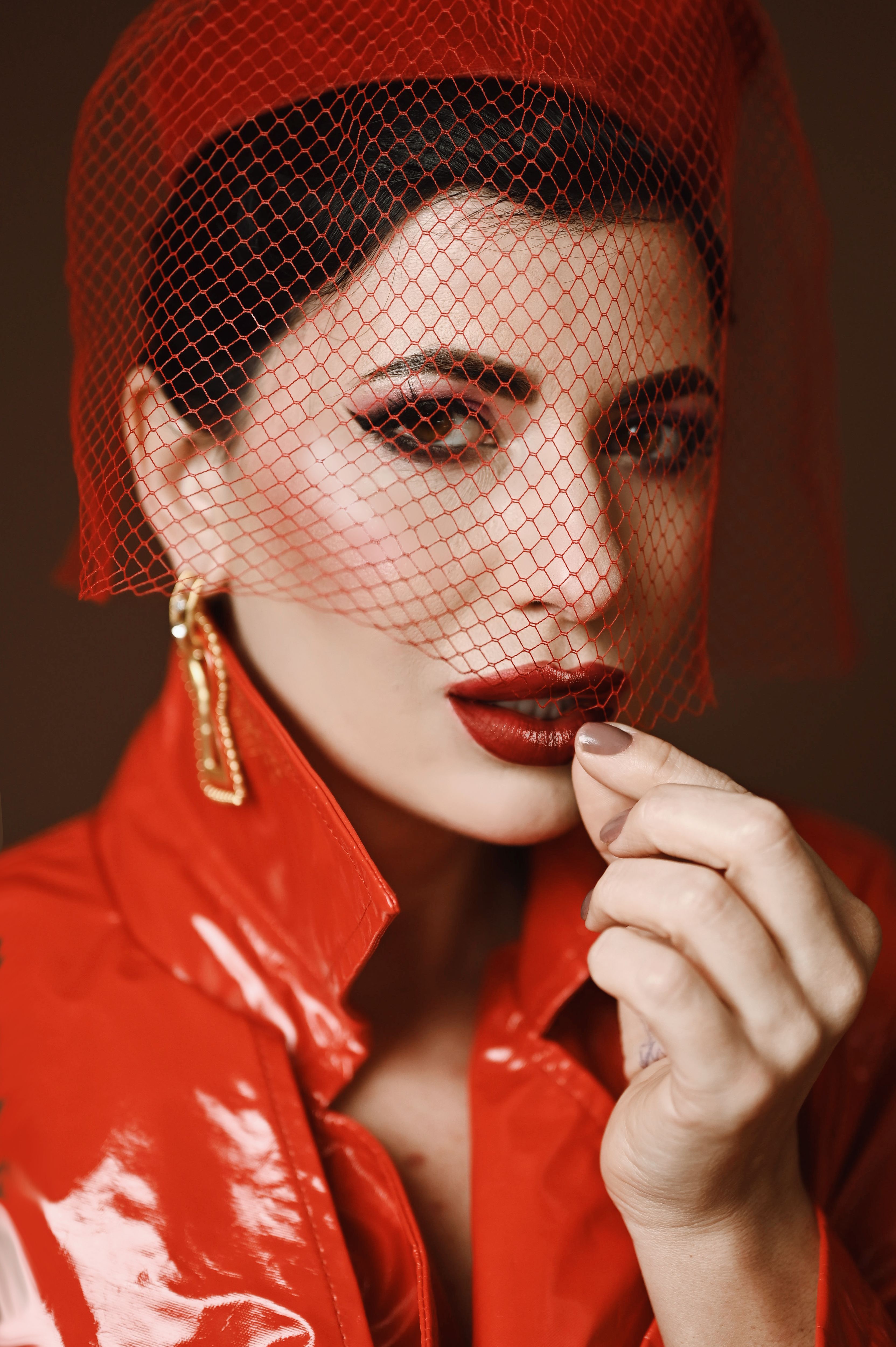 Elegant Woman in Red Veil and Trench Coat · Free Stock Photo