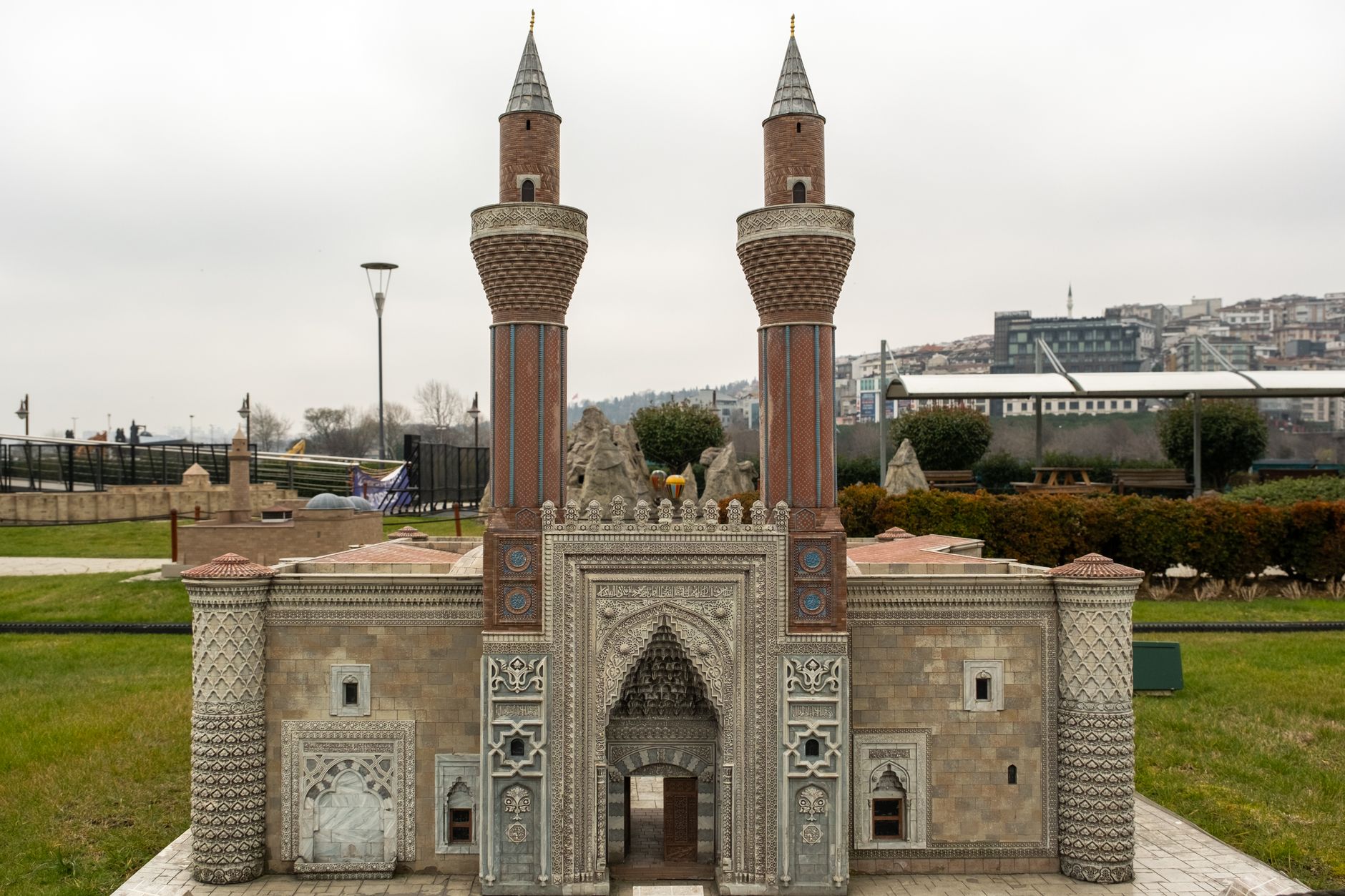 A detailed miniature model of Ishak Pasha Palace located in a park setting in Istanbul, Turkey.