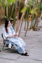 Serene Woman Reading in a Bamboo Grove