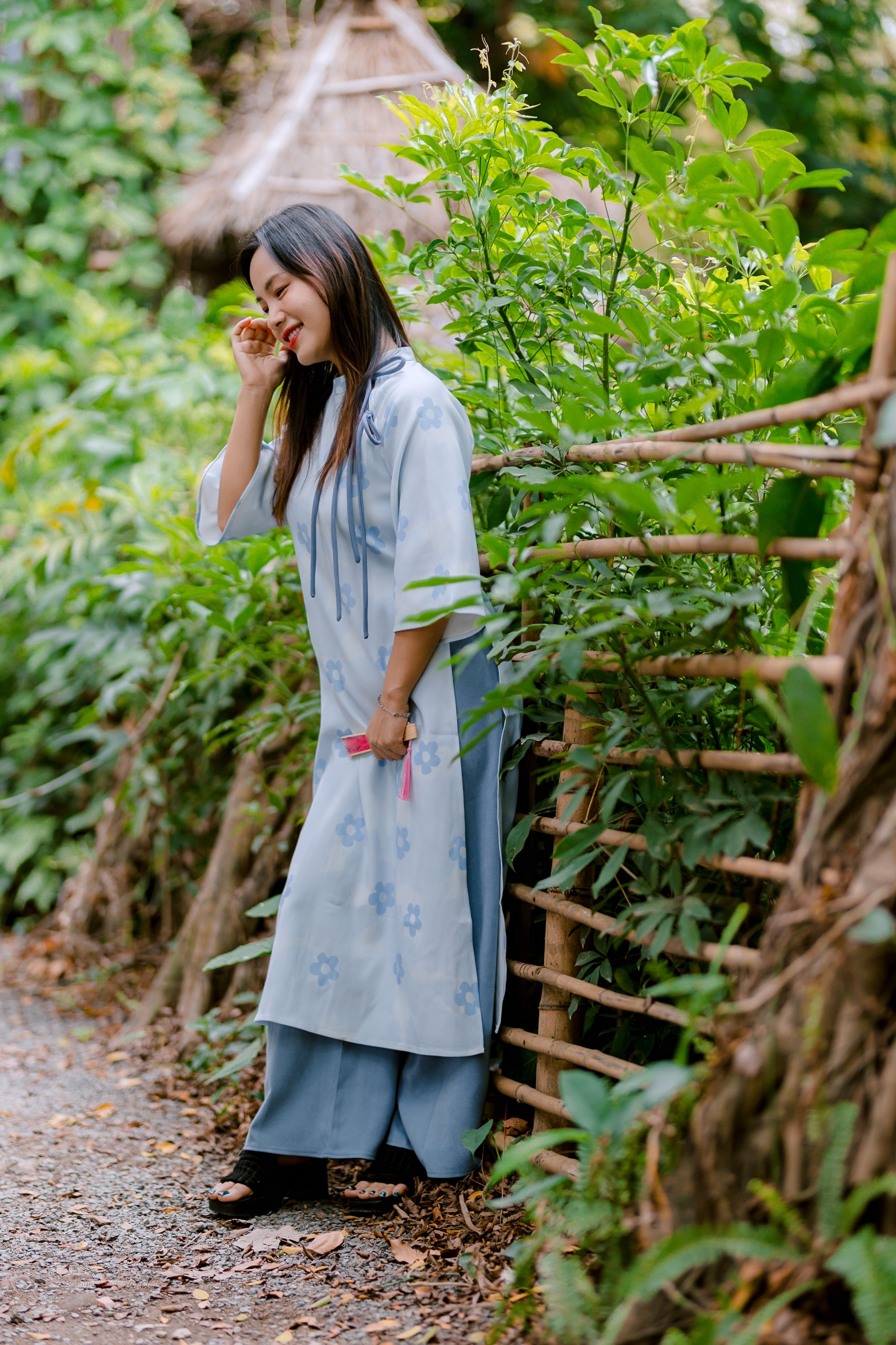 Smiling Woman in Traditional Dress Outdoors · Free Stock Photo
