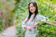 Woman in Nature with Vibrant Greenery Outdoors
