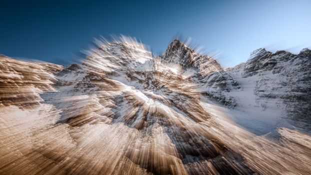 Dynamic mountain landscape with motion blur effect in Preda Rossa, Italy.