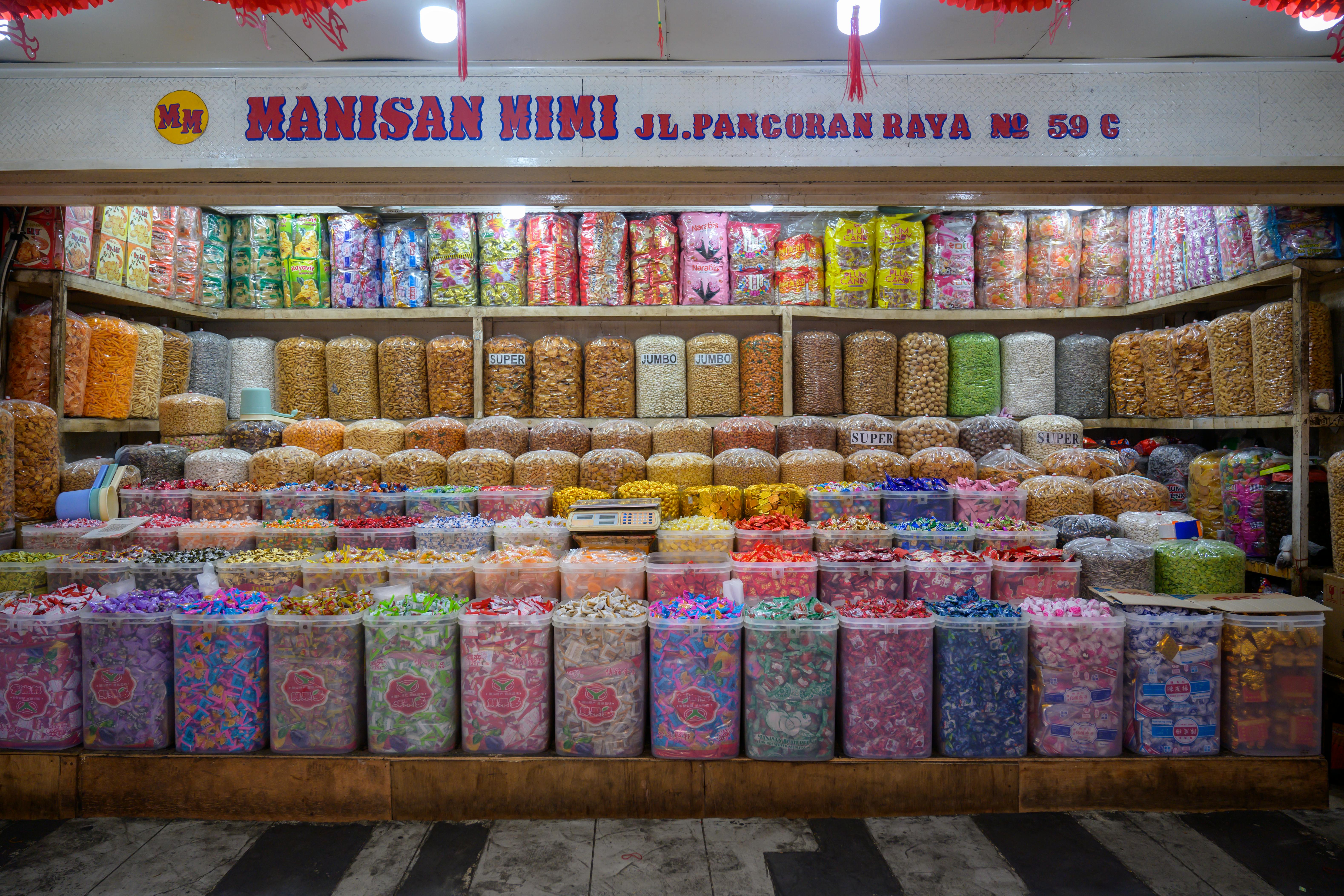 A vibrant display of assorted candies at Manisan Mimi, Jakarta, Indonesia, showcasing colorful local treats.