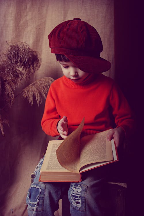 Photo Of Boy Wearing Red Cap 