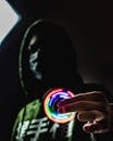 Hooded Figure with Colorful LED Spinner