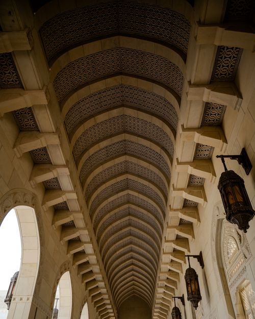Free View of detailed archway ceiling design featuring ornate lanterns. Stock Photo