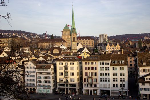 Capture of Zurich's historic architecture and St. Peter's Church in warm evening light.