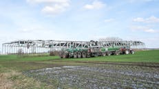 Large Agricultural Machine on Green Field in Spring