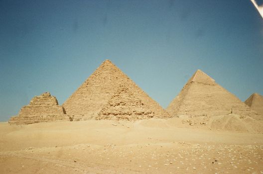 Iconic view of the Pyramids of Giza in Egypt on a sunny day.