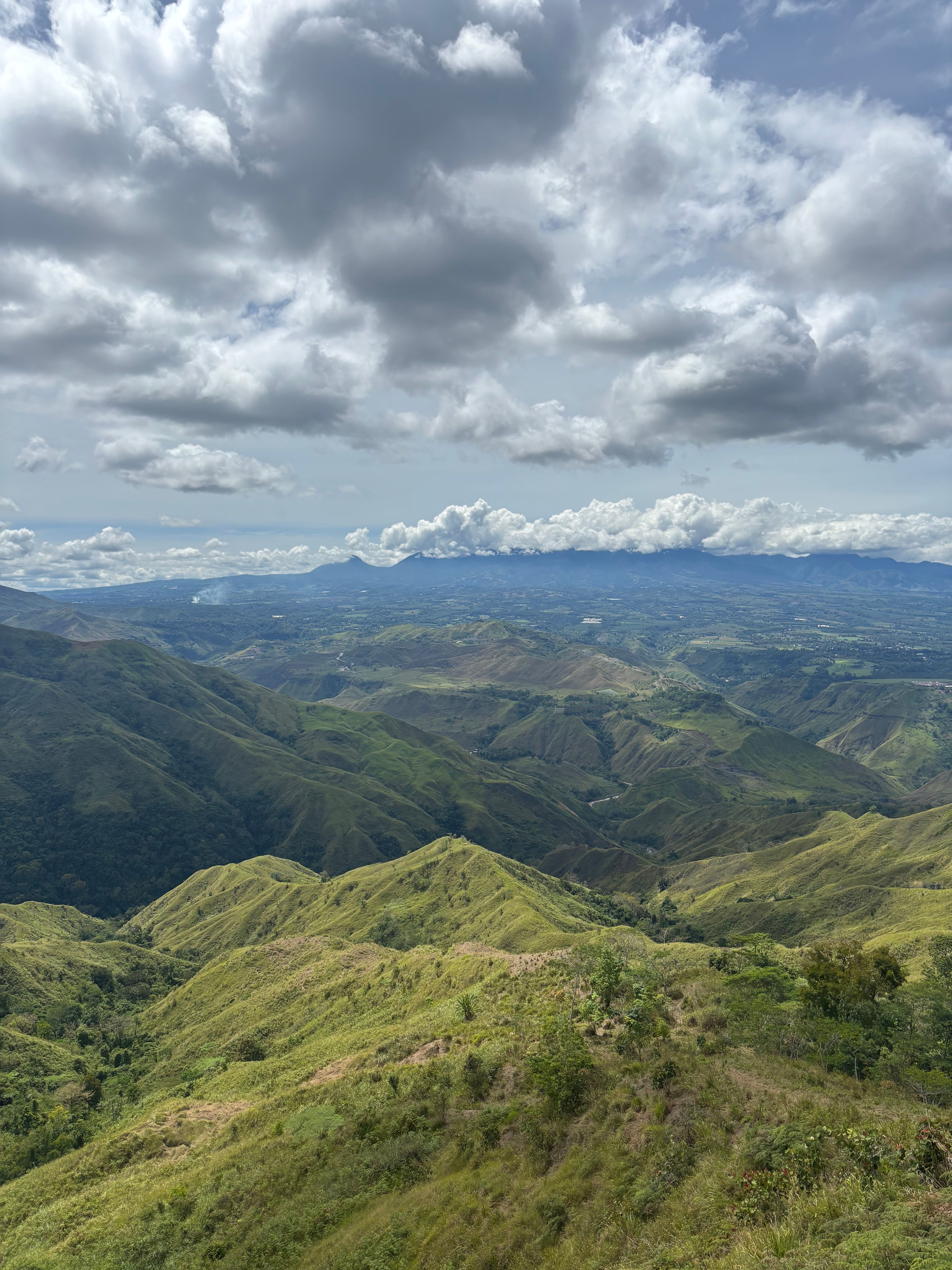 Aerial View of Green Mountain under Cloudy Sky · Free Stock Photo