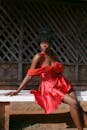 Elegant Woman in Red Dress Outdoors in Jos, Nigeria